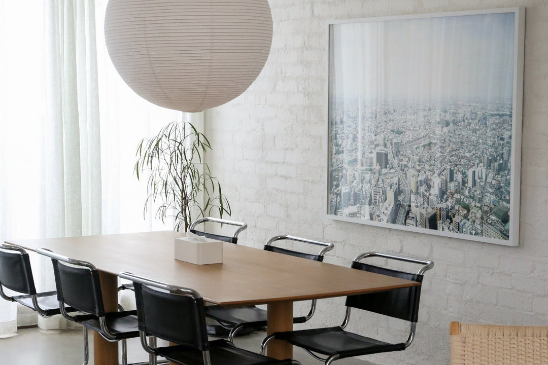 A light-filled dining space in the Thornbury townhouse, where functional townhouse design blends with timeless materials and natural textures.