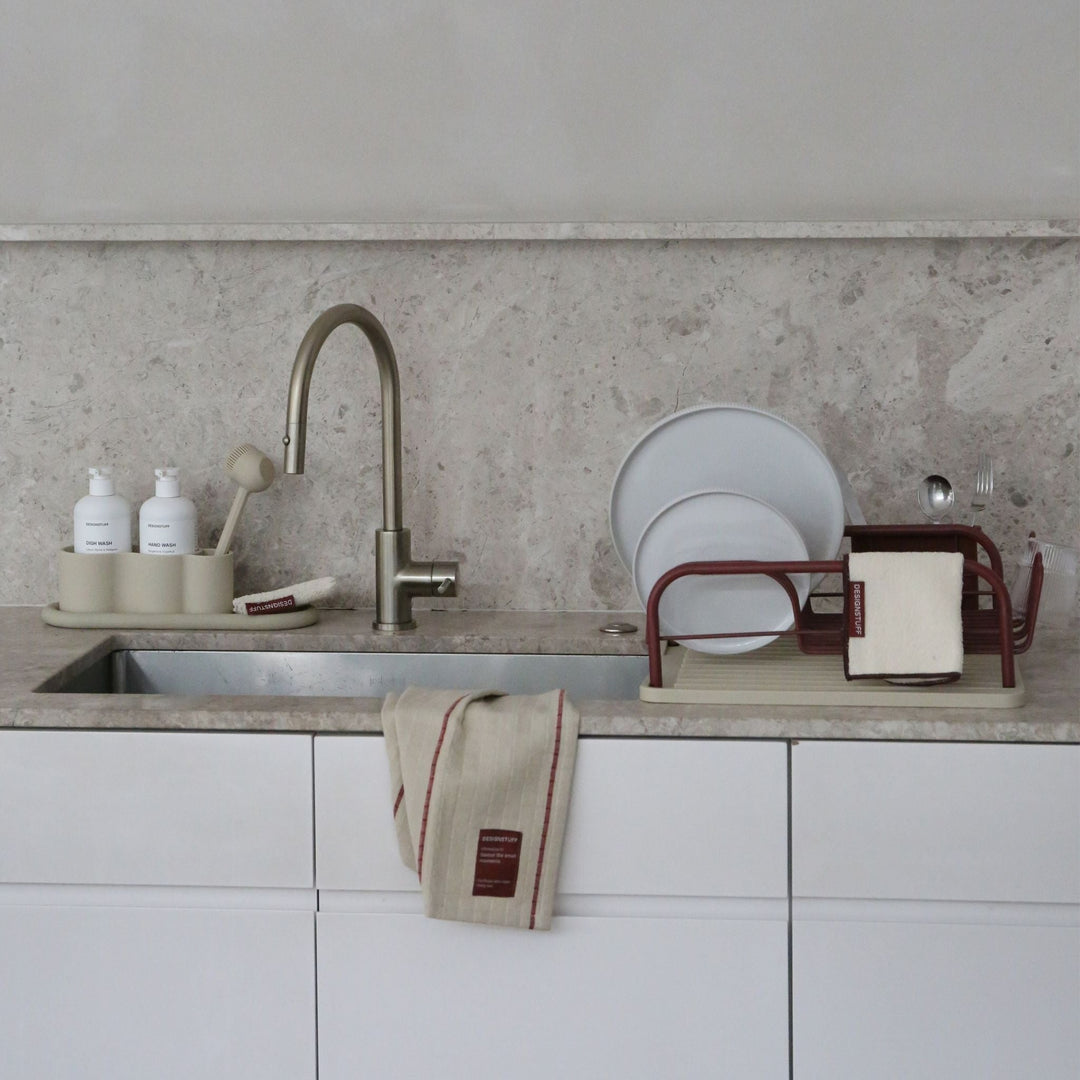 Quiet Resolve Kitchen collection by Designstuff (rack, mat, brush in a modern minimalist kitchen)