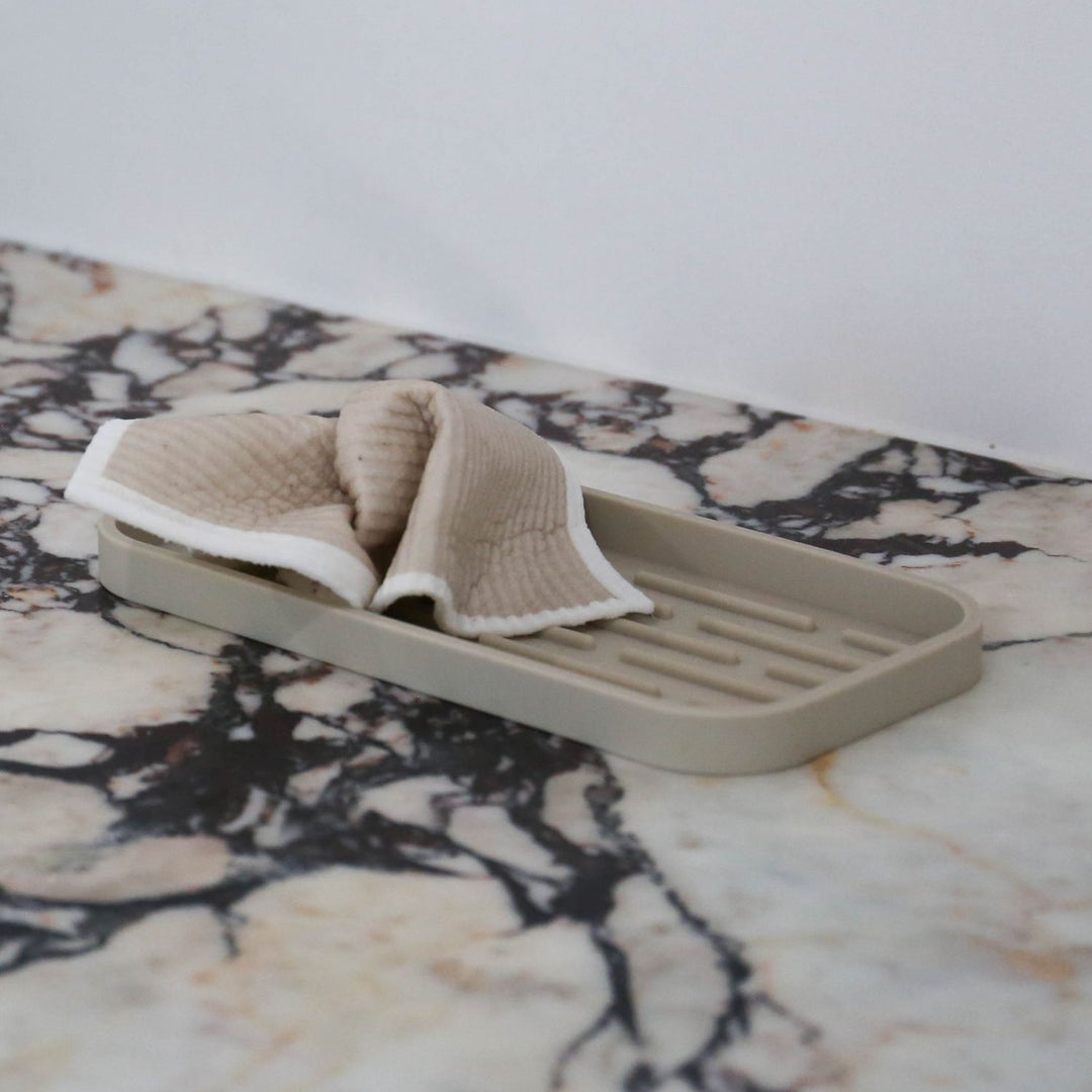 Designstuff Sand Sink Tray on a marble bench top