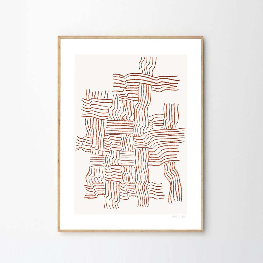 A framed art poster featuring brown, intersecting, uneven and woven lines hung on a light grey wall.