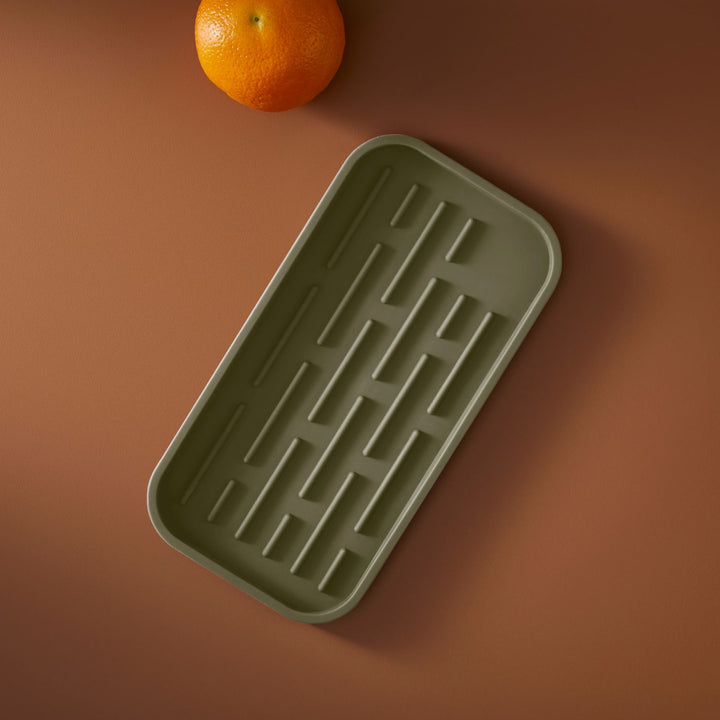 DESIGNSTUFF Sink Tray and Sponge Holder Silicone, Khaki. next to an orange