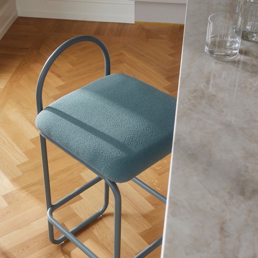 Studio lighting, top view of a stool placed next to a marble counter