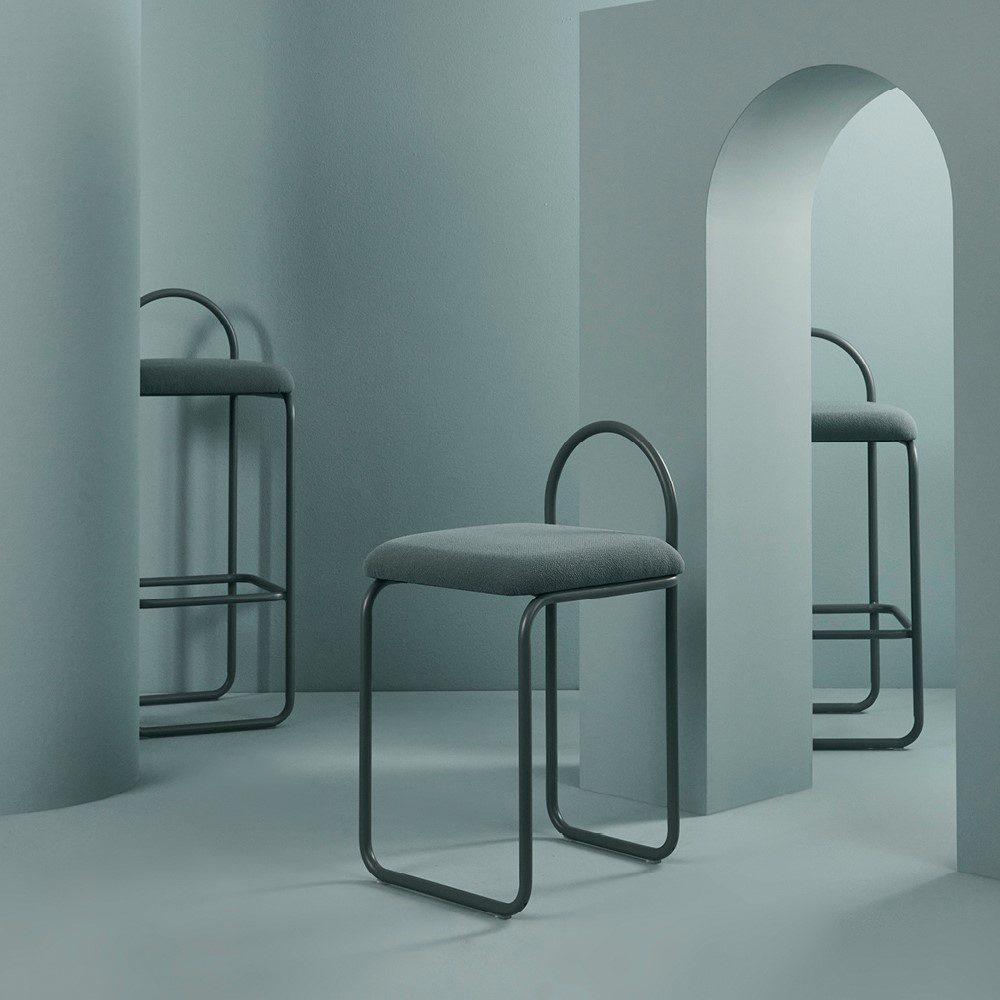 Studio lighting, perspective view of three stools in a hallway