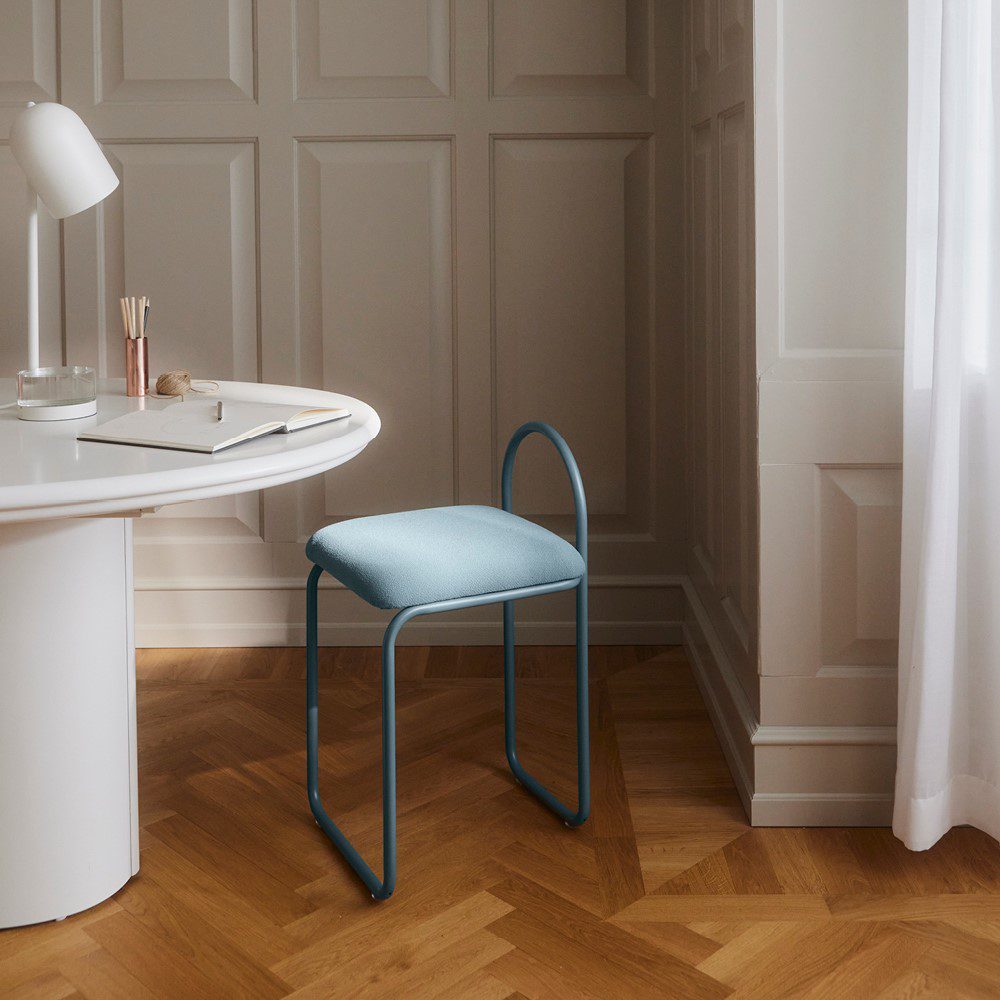 Natural lighting, perspective view of a chair placed next to a table