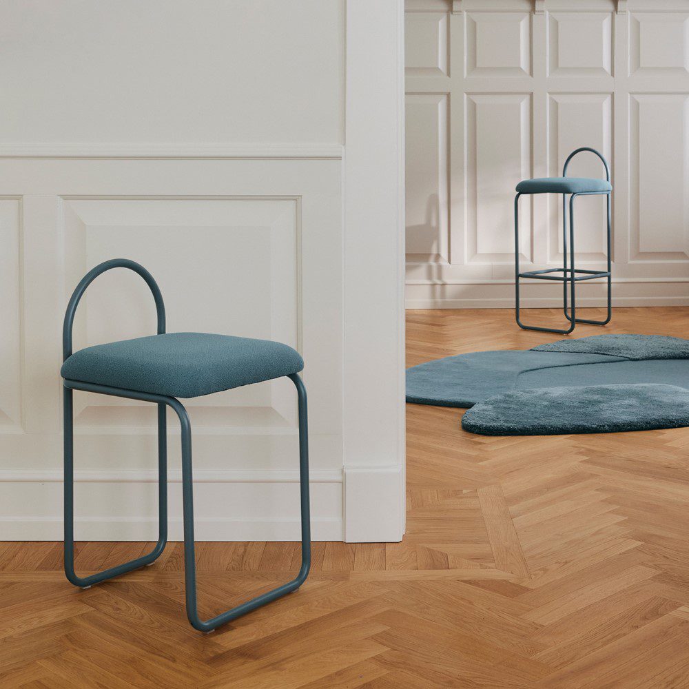 Natural lighting, perspective view of two separate chairs placed in a room