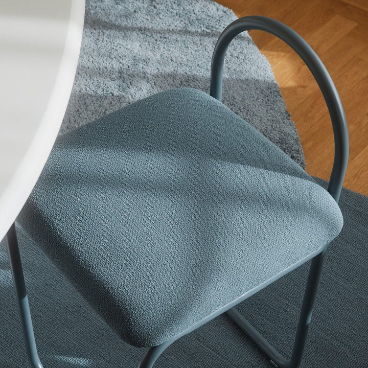 Natural lighting, cropped, top view of a chair next to a table