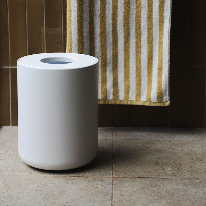 DESIGNSTUFF Round bin White in a tiles bathroom