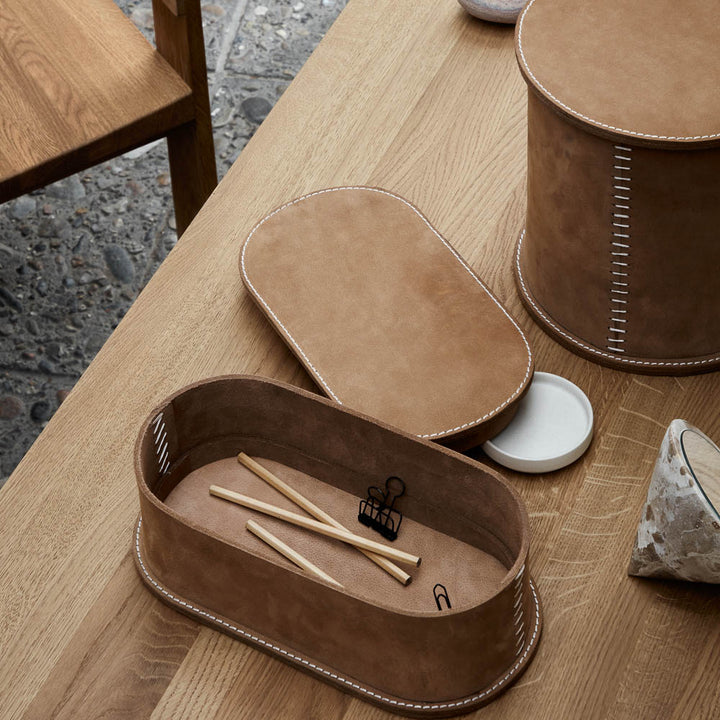 Stiched leather box on the oak table by Kristina Dam Studio