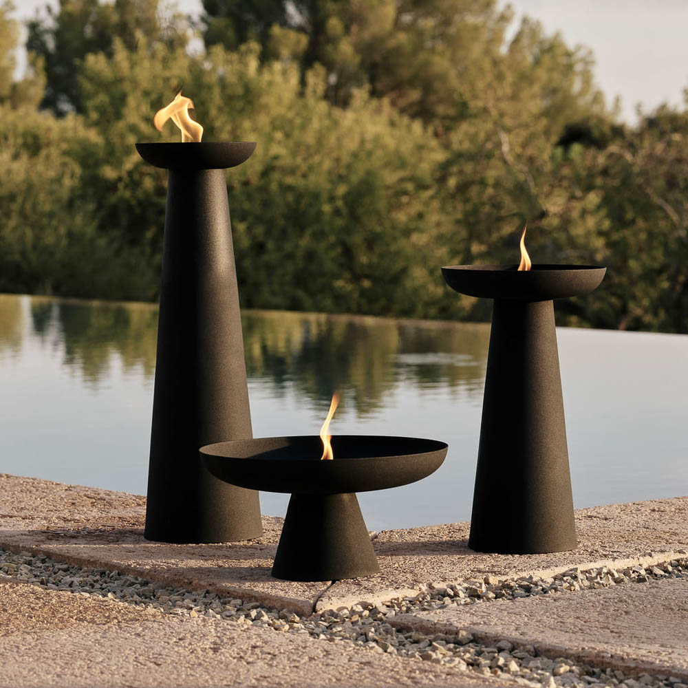 The outdoor flame made from powder-coated steel Meira Oil Lantern by Menu in black with four different sizes.