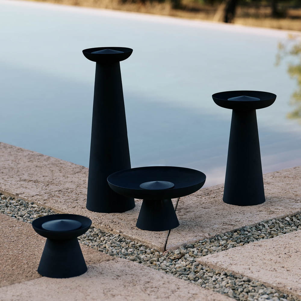 The outdoor flame made from powder-coated steel Meira Oil Lantern by Menu in black with four different sizes.