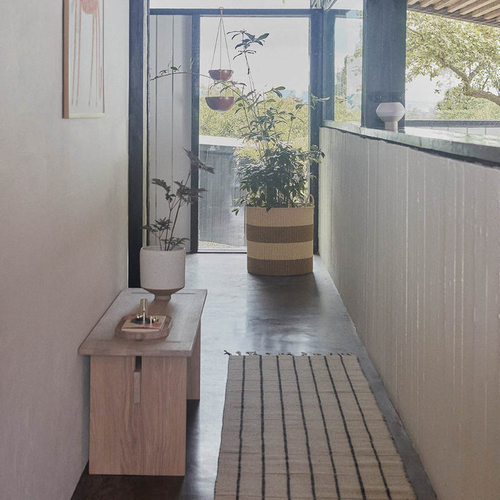 A hallway Kotai bench made from 100% oak.