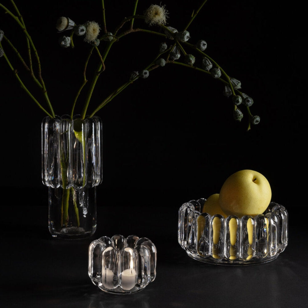 A collection of decorative hand-made glass Press bowl and vase by Tom Dixon.