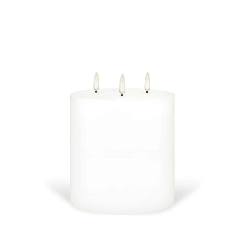 A three-wicked, flameless pillar candle.