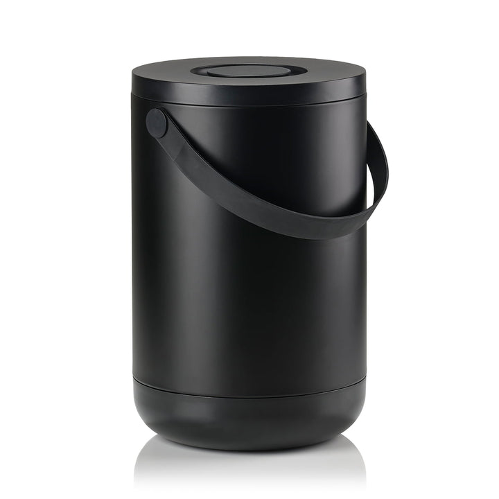 White background, perspective view studio image of a tall, black, cylindrical trash bin with a pail-type handle.