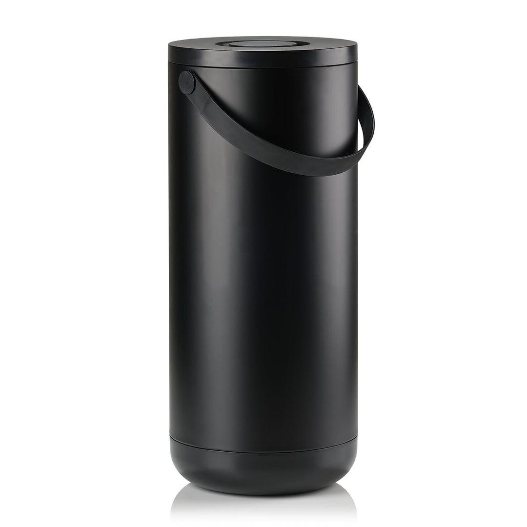 White background, studio image of a tall, black, cylindrical trash bin with a pail-type handle.