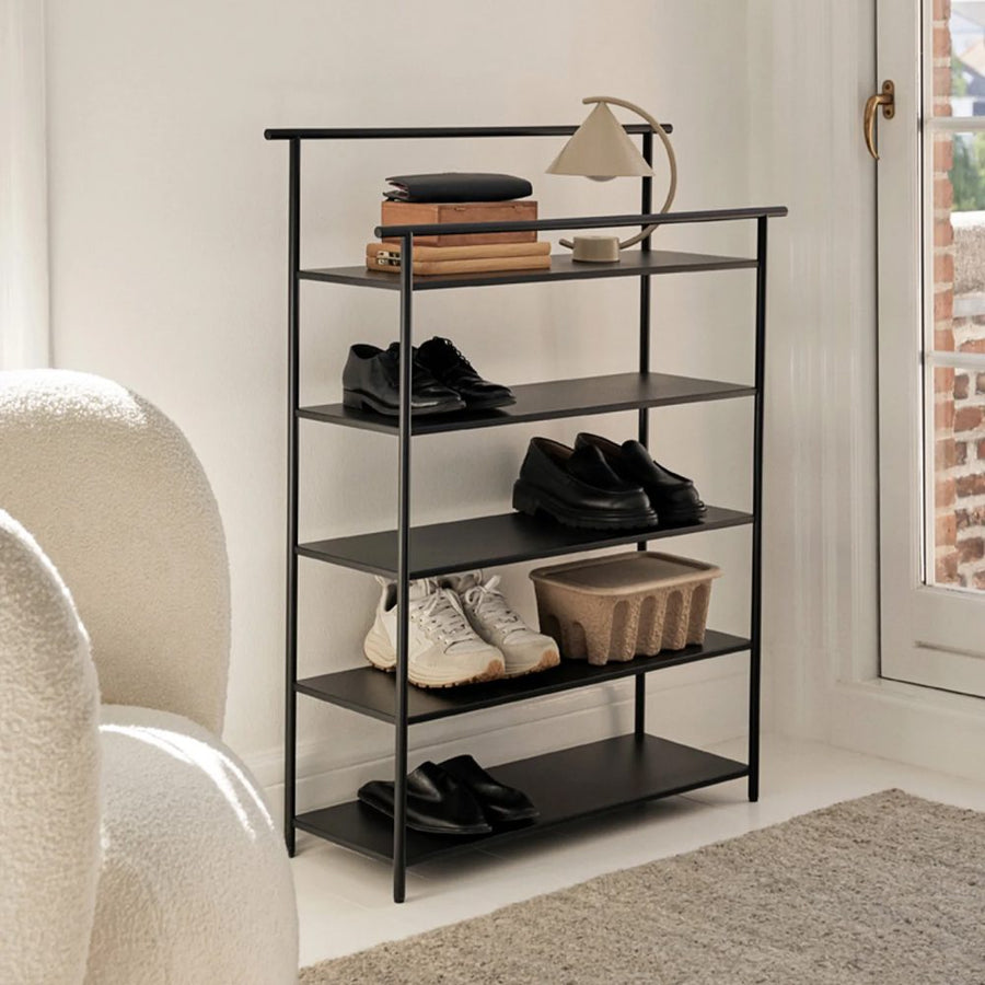 ferm LIVING Dora Rack, Black in an entrance next to a door