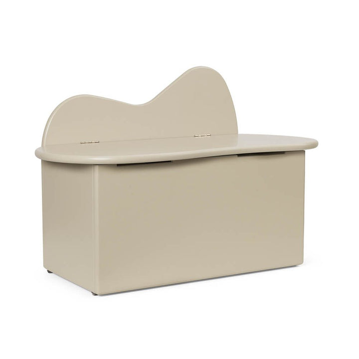 An organic shaped kids storage bench in cashmere made from certified MDF.