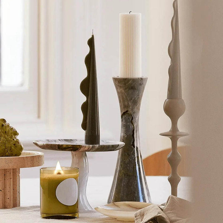 Versatile palm vase and a candle holder made from icy jade marble on a dining table for modern homes.