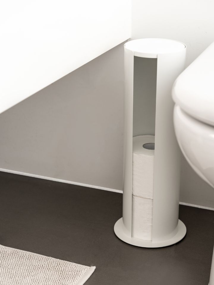 Designstuff toilet roll storage holder styled next to a toilet